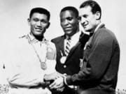 FILE - In this Sept. 7, 1960, file photo, Rafer Johnson of Kingsburg, Calif., is flanked by runners-up, Chuan-Kwang Yang, left, of Taiwan, and Vasily Kuznetsov of Russia, as they join in three-way handshake after receiving medals for the decathlon event of the Olympics in Rome, Italy. Rafer Johnson, who won the decathlon at the 1960 Rome Olympics and helped subdue Robert F. Kennedy&#039;s assassin in 1968, died Wednesday, Dec. 2, 2020. He was 86. He died at his home in the Sherman Oaks section of Los Angeles, according to family friend Michael Roth.