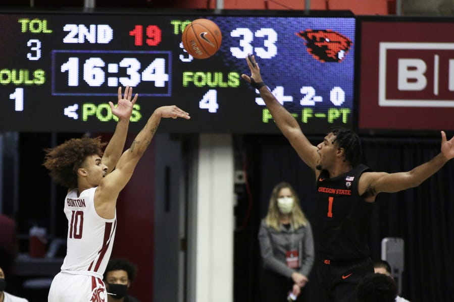 Washington State guard Isaac Bonton (10) shoots over Oregon State forward Maurice Calloo (1) during the second half of an NCAA college basketball game in Pullman, Wash., Wednesday, Dec. 2, 2020. Washington State won 59-55.