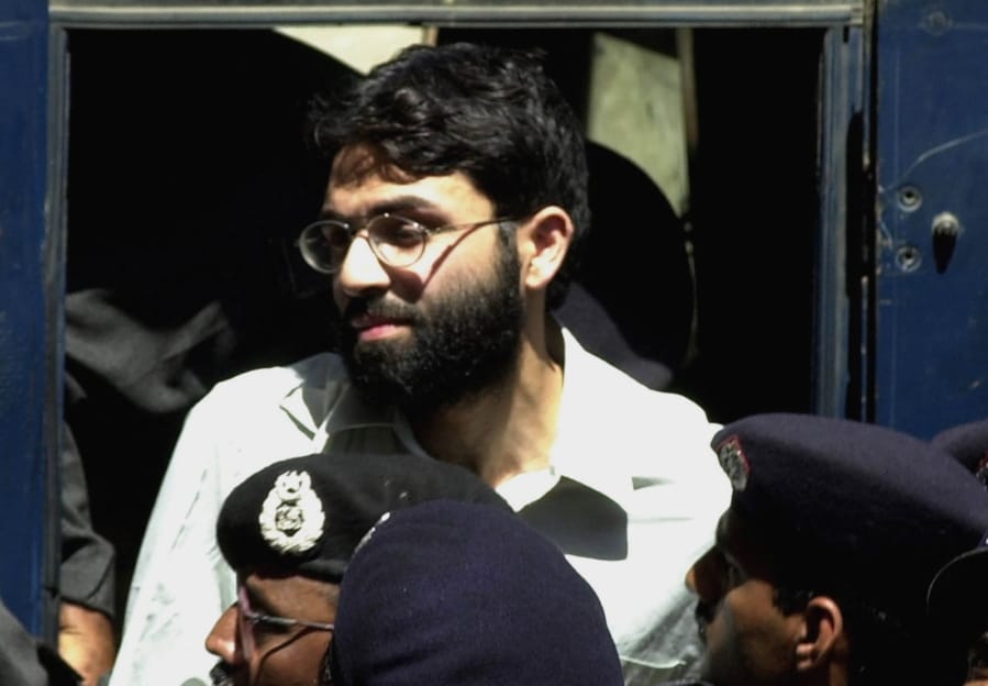 FILE- In this March 29, 2002 file photo, Ahmed Omar Saeed Sheikh, the alleged mastermind behind Wall Street Journal reporter Daniel Pearl&#039;s kidnap-slaying, appears at the court in Karachi, Pakistan. On Thursday, Dec. 24, 2020, a provincial court in Pakistan overturned a Supreme Court Decision that Sheikh should remain in custody during an appeal of his acquittal on charges he murdered Pearl.