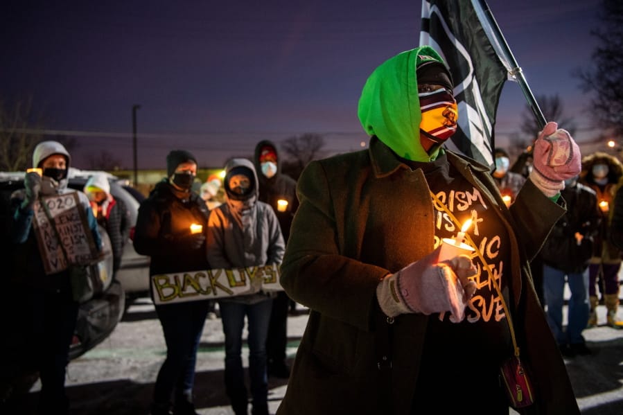 A vigil is held for Andre&#039; Hill at the Brentnell Community Recreation Center on Columbus. Ohio, Saturday, Dec. 26, 2020. The police chief of Columbus, Ohio, recommended on Thursday, Dec. 24, 2020, that the officer who shot and killed Hill, a 47-year-old Black man, earlier this week be fired.