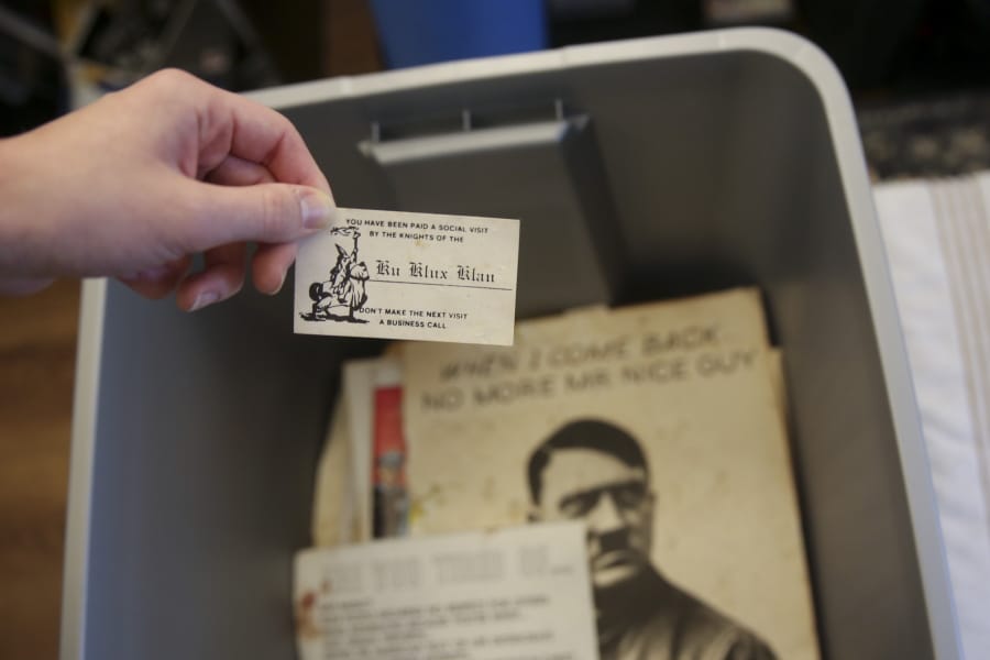 Some of the racist material collected over decades by former Ku Klux Klan leader John Howard is seen on Dec. 9, 2020, in Columbia, S. C.. Howard also ran The Redneck Store in Laurens, South Carolina, for decades. The Echo Group is renovating the shop into a community center and racial reconciliation museum.
