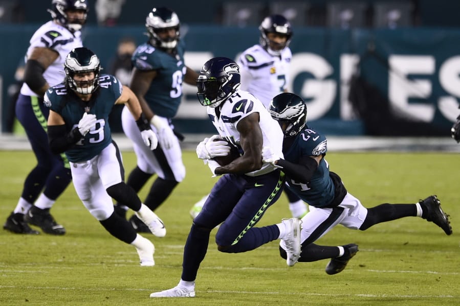 Seattle Seahawks&#039; DK Metcalf, left, is tackled by Philadelphia Eagles&#039; Darius Slay during the first half of an NFL football game, Monday, Nov. 30, 2020, in Philadelphia.