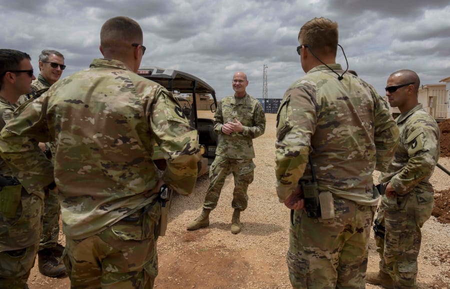 U.S. Army Brig. Gen. Damian T. Donahoe, deputy commanding general, Combined Joint Task Force - Horn of Africa, center, talks with service members during a battlefield circulation Saturday, Sept. 5, 2020, in Somalia. No country has been involved in Somalia&#039;s future as much as the United States but now the Trump administration is thinking of withdrawing the several hundred U.S. military troops from the nation at what some experts call the worst possible time.