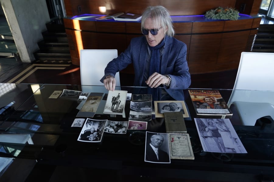 Jed Leiber shows photos of his grandfather Saemy Rosenberg&#039;s life at home Thursday, Dec. 3, 2020, in Los Angeles.