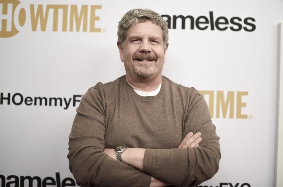 FILE - John Wells attends the &quot;Shameless&quot; FYC event in Los Angeles on March 6, 2019. The final season of Well&#039;s Chicago set drama series premieres on Dec. 6.