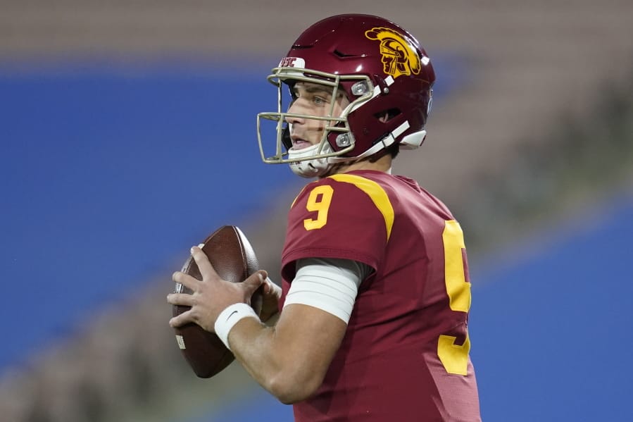 Southern California quarterback Kedon Slovis (9) looks for a receiver during the first quarter of an NCAA college football game against UCLA, Saturday, Dec 12, 2020, in Pasadena, Calif.