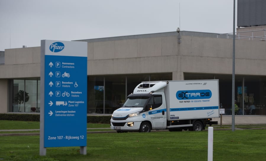 A refrigerated truck drives out of the Pfizer Manufacturing plant in Puurs, Belgium, on Thursday, Dec. 3, 2020. British officials on Wednesday authorized a COVID-19 vaccine for emergency use, greenlighting the world&#039;s first shot against the virus that&#039;s backed by rigorous science and taking a major step toward eventually ending the pandemic.