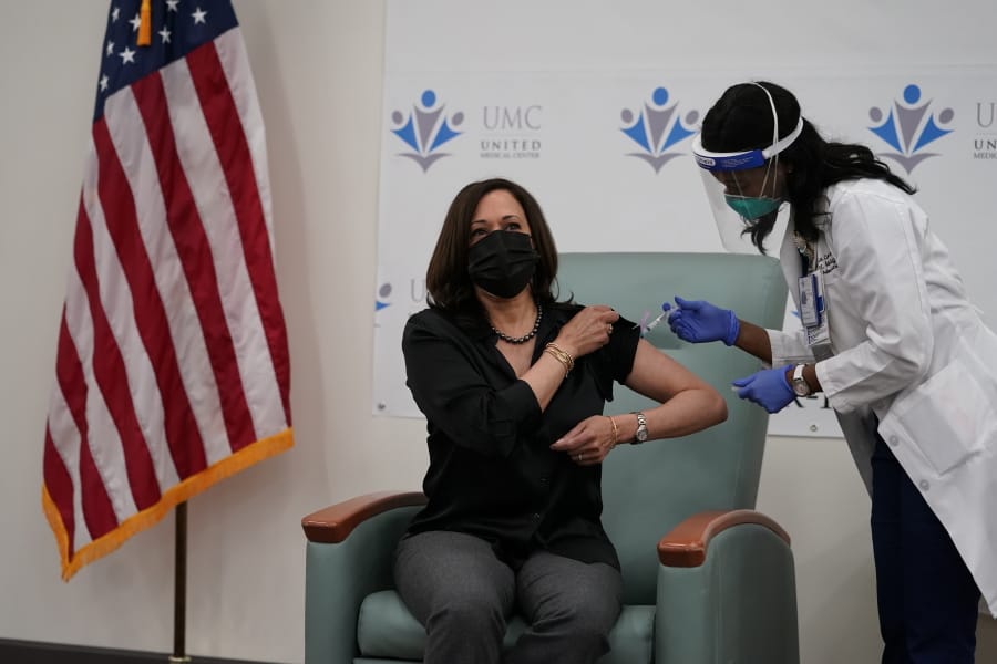 Vice President-Elect Kamala Harris receives the Moderna COVID-19 vaccine from nurse Patricia Cummings, Tuesday Dec. 29, 2020, at United Medical Center in southeast Washington.