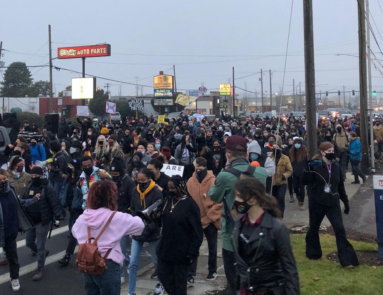 A few hundred protesters march down Highway 99 in Hazel Dell, the latest in a string of demonstrations since Kevin E. Peterson Jr. was fatally shot by police on Oct. 29.