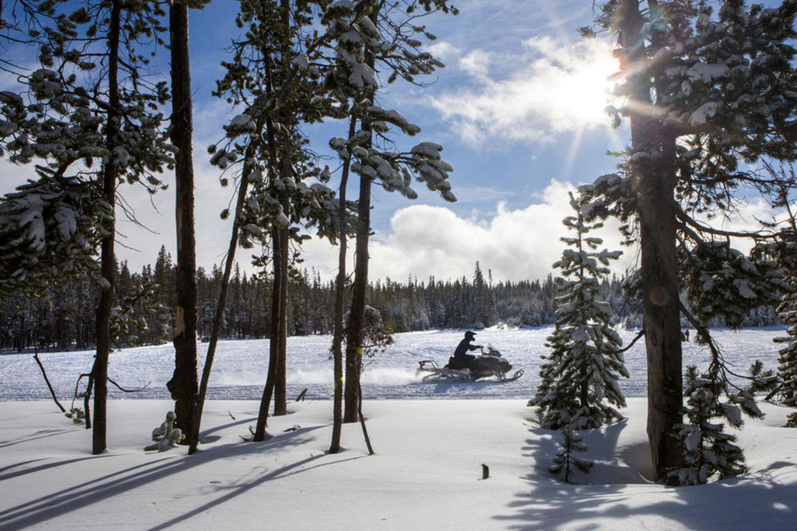 A snowmobiler rides around a clearing at Wanoga Sno-park in Bend. Ore.