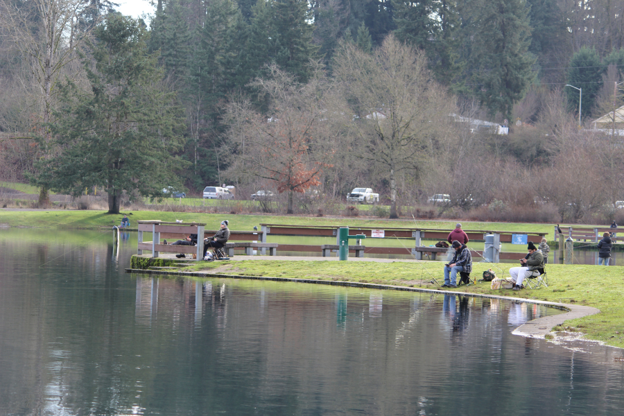 Anglers try their luck for trout at Klineline Pond in Salmon Creek Park in Vancouver recently. With most indoor recreation shut down because of the COVID-19 pandemic, more and more people are turning to fishing, hunting, and other outdoor activities.