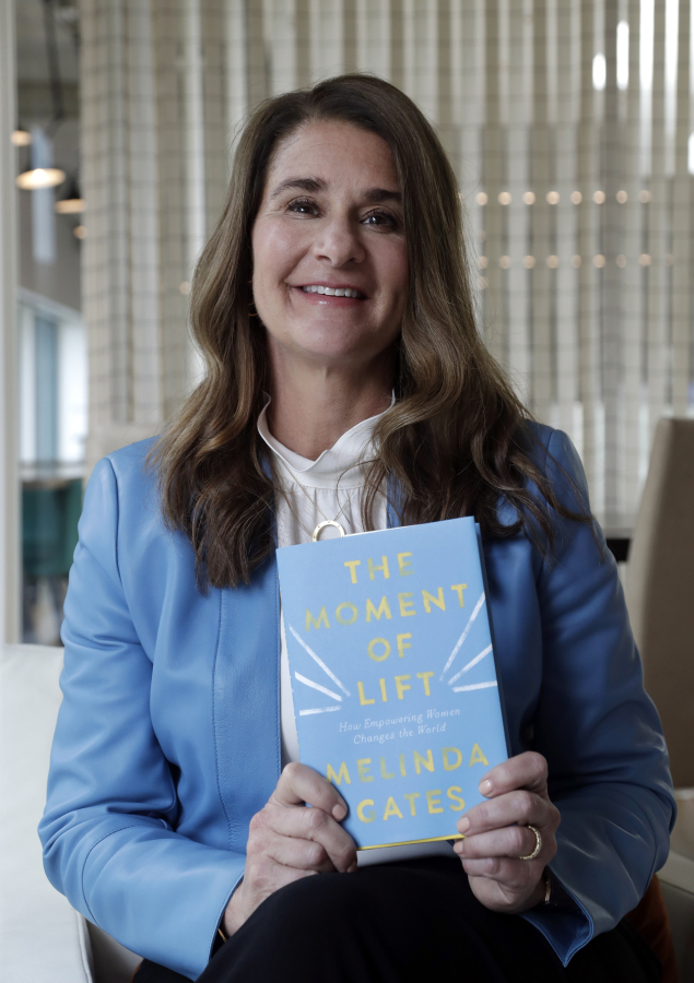 Melinda Gates poses April 18, 2019, for a photo with her new book, &quot;The Moment of Lift,&quot; in Kirkland.