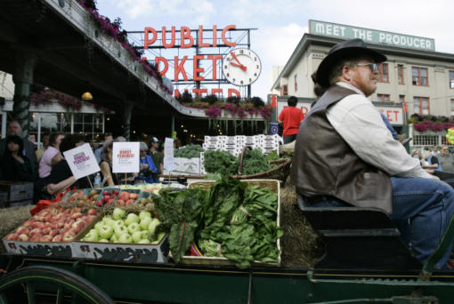 A horse drawn produce wagon driven by Wayne Buckner, of Falls City, sits in 2007 at the Pike Place Market in Seattle.