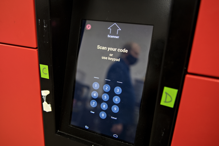 Customers use their smartphones to generate a QR code, which the cabinet scans, to open the door and retrieve their orders.