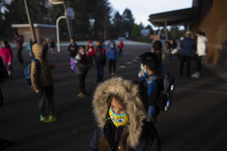 First-grader Mia Pierce, 6, bundles up in a coat before attending hybrid classes at Crestline Elementary School on Tuesday morning, January 19, 2021. More Clark County schools are welcoming students back to the classroom for hybrid learning.