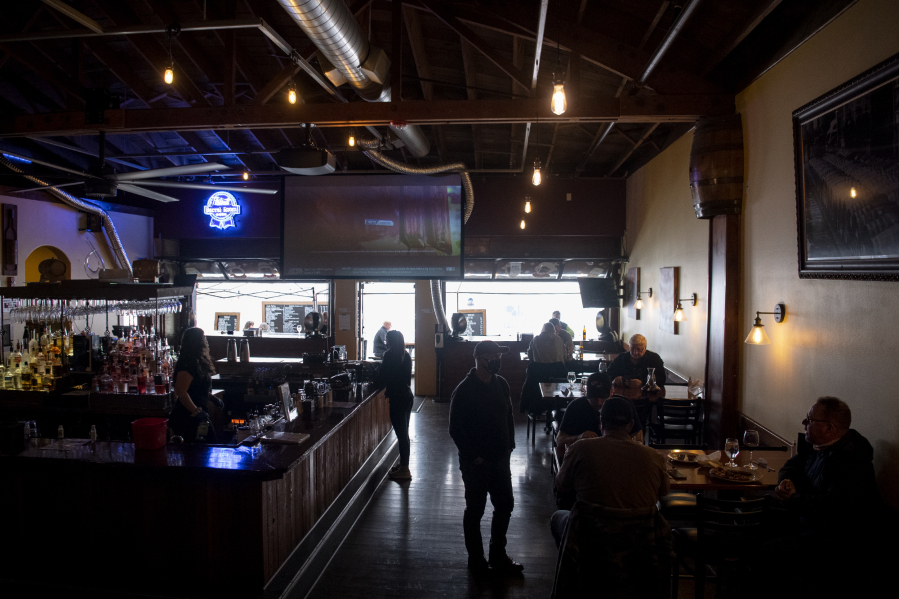Guests eat indoors on Tuesday at Uptown Barrel Room in Vancouver&#039;s Uptown Village.