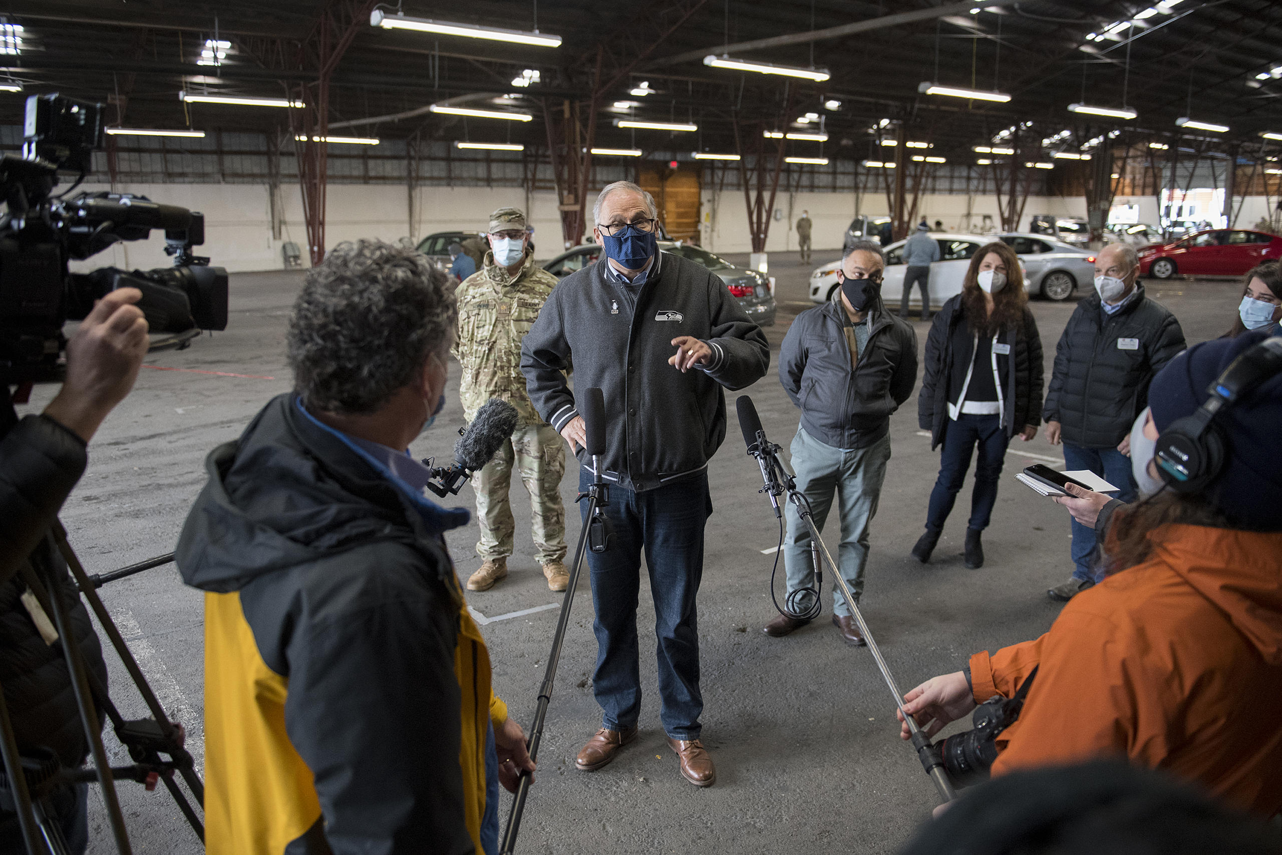 Gov. Jay Inslee speaks to members of the media during a tour of the mass COVID-19 vaccination site at the Clark County Fairgrounds on Thursday morning, January 28, 2021.