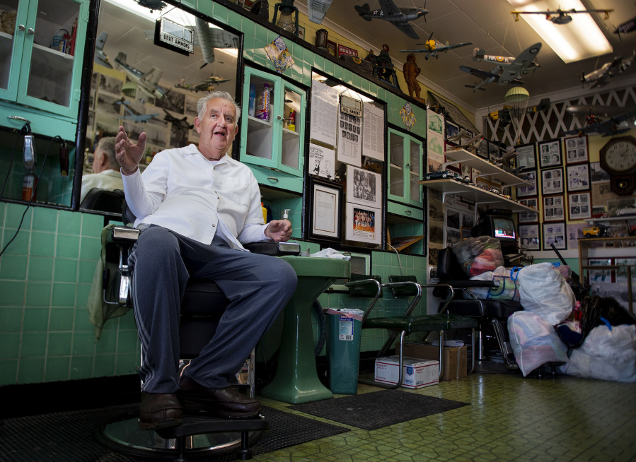 Now-retired Kelso barber Bill Ammons sits in the salon chair at his shop, Pacific Barber Shop, in June 2019.