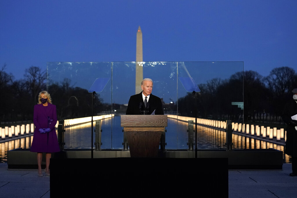 President-elect Joe Biden speaks during a COVID-19 memorial, with lights placed around the Lincoln Memorial Reflecting Pool, Tuesday, Jan. 19, 2021, in Washington.