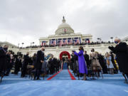 Vice President-elect Kamala Harris applauds as President-elect Joe Biden arrives for the 59th Presidential Inauguration at the U.S. Capitol in Washington, Wednesday, Jan. 20, 2021.