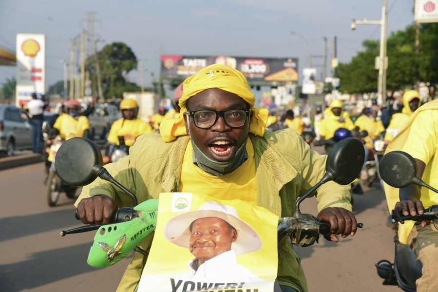 A supporter of Ugandan President Yoweri Kaguta Museveni celebrates in Kampala, Uganda, Saturday Jan. 16, 2021, after their candidate was declared winner of the presidential elections.  Uganda&#039;s electoral commission says longtime President Yoweri Museveni has won a sixth term, while top opposition challenger Bobi Wine alleges rigging and officials struggle to explain how polling results were compiled amid an internet blackout. In a generational clash widely watched across the African continent, the young singer-turned-lawmaker Wine posed arguably the greatest challenge yet to Museveni.