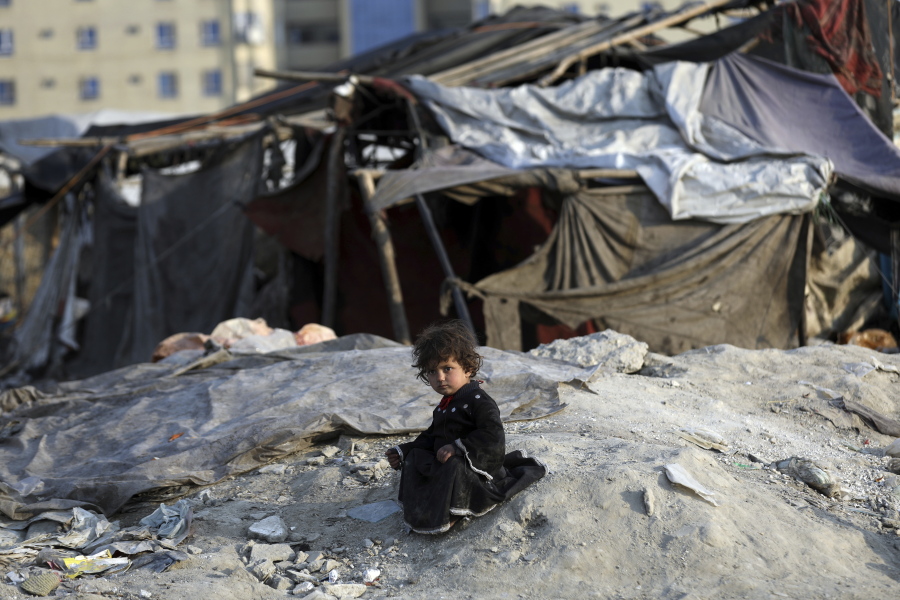 An internally displaced girl poses for photograph outside her temporary home in the city of Kabul, Afghanistan, Monday, Jan. 18, 2021. Half of war-ravaged Afghanistan&#039;s population is at risk of not having enough food to eat, including around 10 million children, Save the Children, a humanitarian organization said Tuesday. The group called for $3 billion in donations to pay for assistance in 2021.