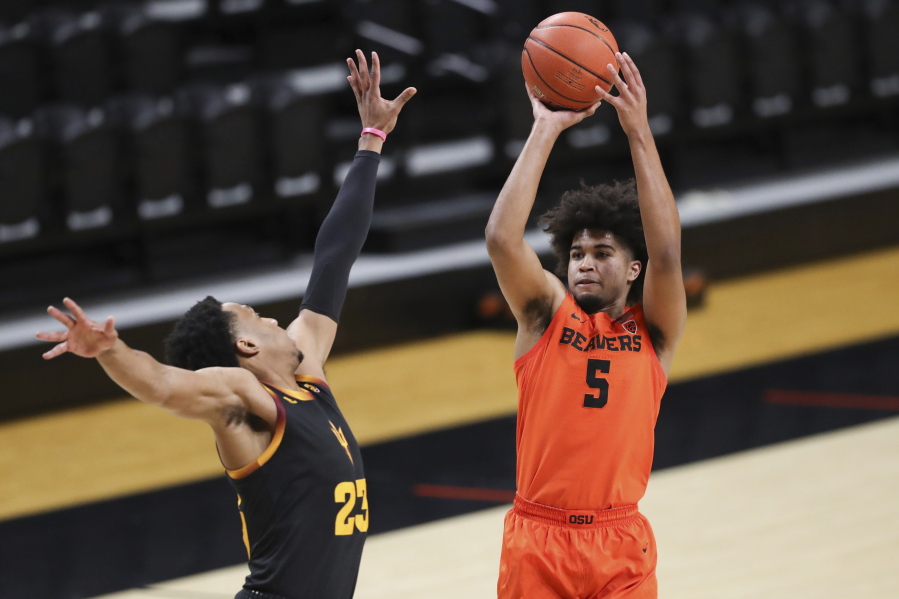 Oregon State&#039;s Ethan Thompson (5) shoots over Arizona State&#039;s Marcus Bagley (23) during the first half of an NCAA college basketball game in Corvallis, Ore., Saturday, Jan. 16, 2021.