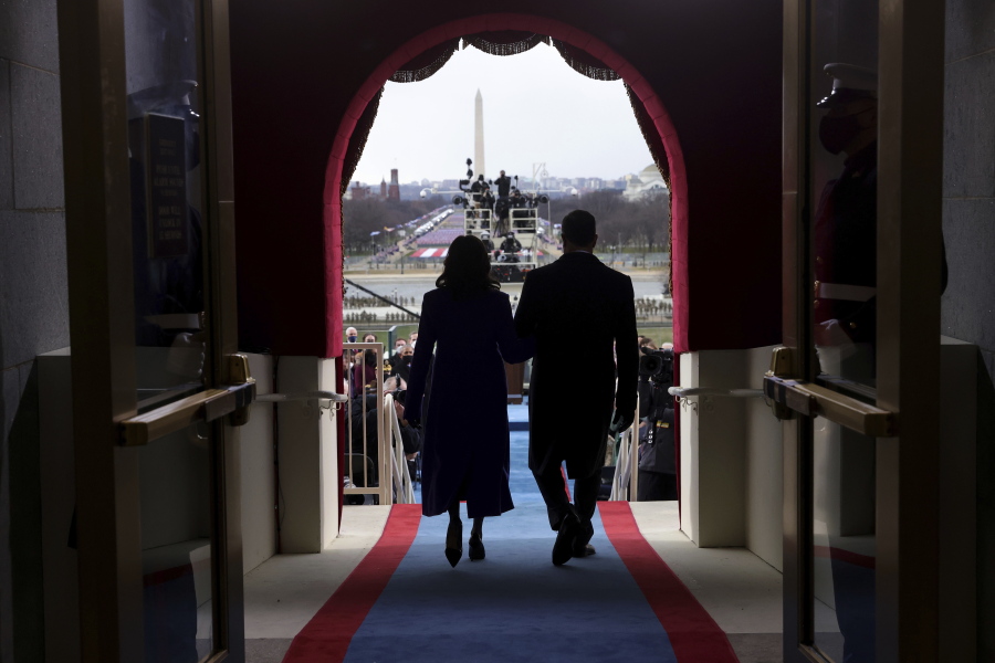 Vice President-elect Kamala Harris and her husband Doug Emhoff arrive for the 59th Presidential Inauguration at the U.S. Capitol in Washington, Wednesday, Jan. 20, 2021.