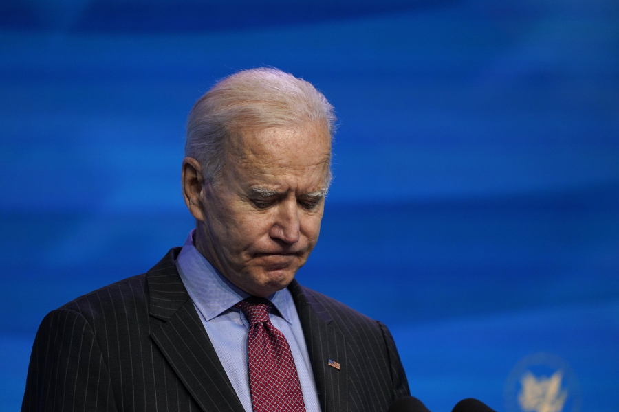 FILE - In this Jan. 8, 2021, file photo President-elect Joe Biden speaks during an event at The Queen theater in Wilmington, Del. When Biden takes office later this month, his biggest challenge may be navigating a deeply divided country past the turmoil of the Trump era.
