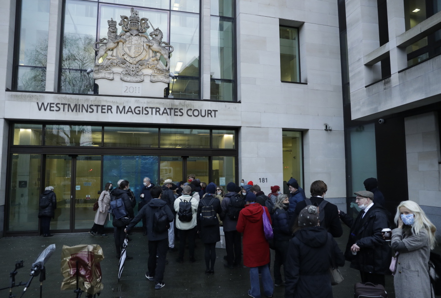 Julian Assange supporters and members of the media queue up outside Westminster Magistrates Court to get a seat at his Bail hearing in London, Wednesday, Jan. 6, 2021. On Monday, Judge Vanessa Baraitser ruled that Julian Assange cannot be extradited to the US. because of concerns about his mental health. Assange had been charged under the US&#039;s 1917 Espionage Act for &quot;unlawfully obtaining and disclosing classified documents related to the national defence&quot;. Assange remains in custody, the US. has 14 day to appeal against the ruling.
