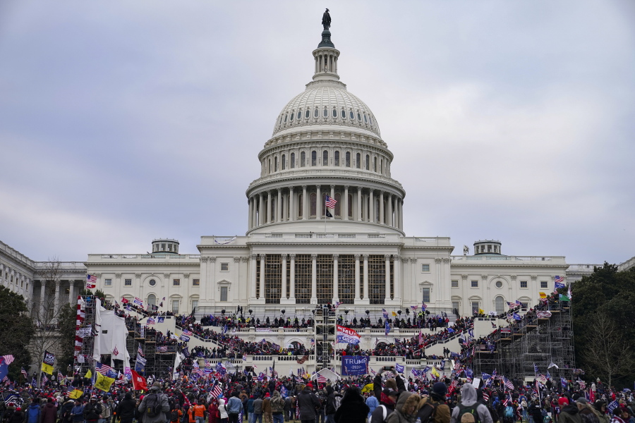 FILE - This file photo from Wednesday Jan. 6, 2021, shows Trump supporters swarming the Capitol, as Congress prepares to affirm President-elect Joe Biden&#039;s victory. A little used Civil War-era statute that outlaws waging war against the United States is getting a fresh look after the attacks on the Capitol.