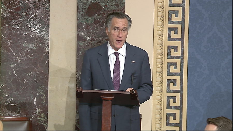 In this image from video, Sen. Mitt Romney, R-Utah, speaks as the Senate reconvenes to debate the objection to confirm the Electoral College Vote from Arizona, after protesters stormed into the U.S. Capitol on Wednesday, Jan. 6, 2021.