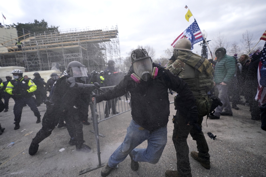 Trump supporters try to break through a police barrier, Wednesday, Jan. 6, 2021, at the Capitol in Washington. As Congress prepares to affirm President-elect Joe Biden&#039;s victory, thousands of people have gathered to show their support for President Donald Trump and his claims of election fraud.