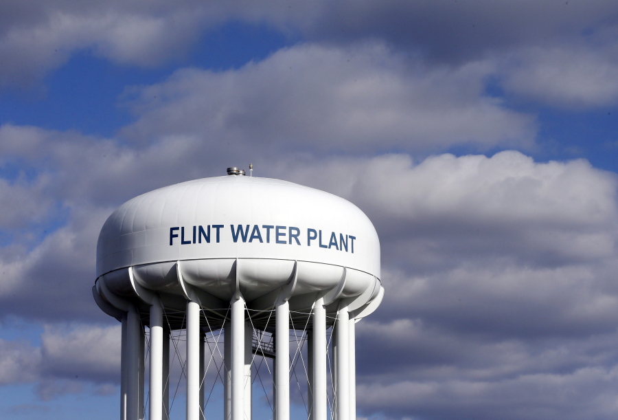 FILE - In this March 21, 2016, file photo, the Flint Water Plant water tower is seen in Flint, Mich. Former Michigan Gov. Rick Snyder, Nick Lyon, former director of the Michigan Department of Health and Human Services, and other ex-officials have been told they&#039;re being charged after a new investigation of the Flint water scandal, which devastated the majority Black city with lead-contaminated water and was blamed for a deadly outbreak of Legionnaires&#039; disease in 2014-15, The Associated Press has learned.