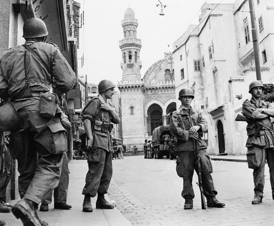 FILE - In this May 27, 1956 file photo, French troops seal off Algiers&#039; notorious casbah, 400-year-old teeming Arab quarter. French President Emmanuel Macron wants to take further steps to reckon with France&#039;s colonial-era wrongs in Algeria but is not considering an official apology, his office said.