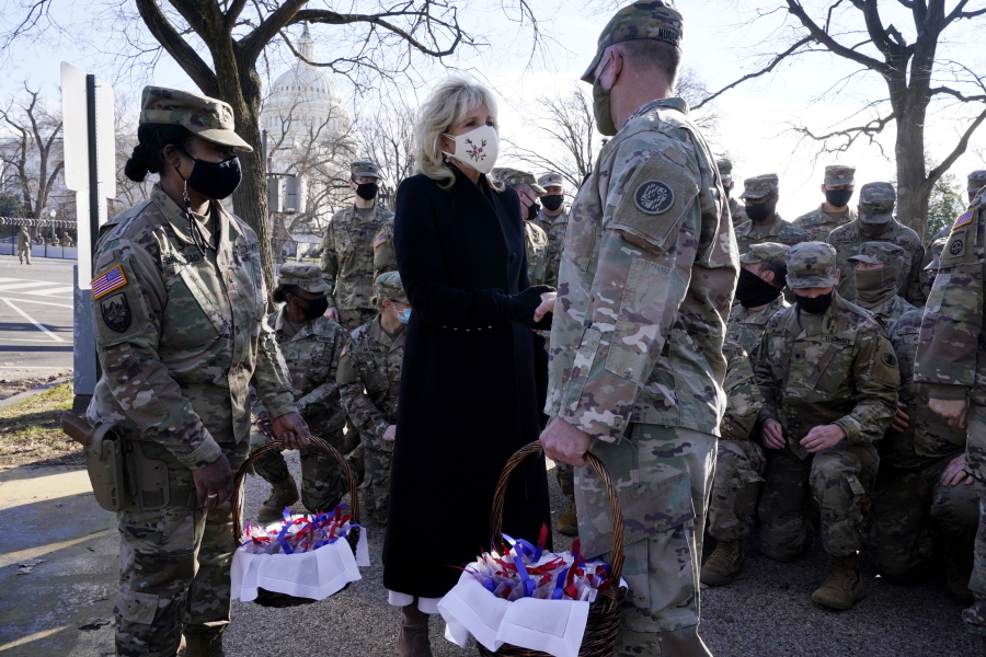 First lady Jill Biden surprises National Guard members outside the Capitol with chocolate chip cookies, Friday, Jan. 22, 2021, in Washington.