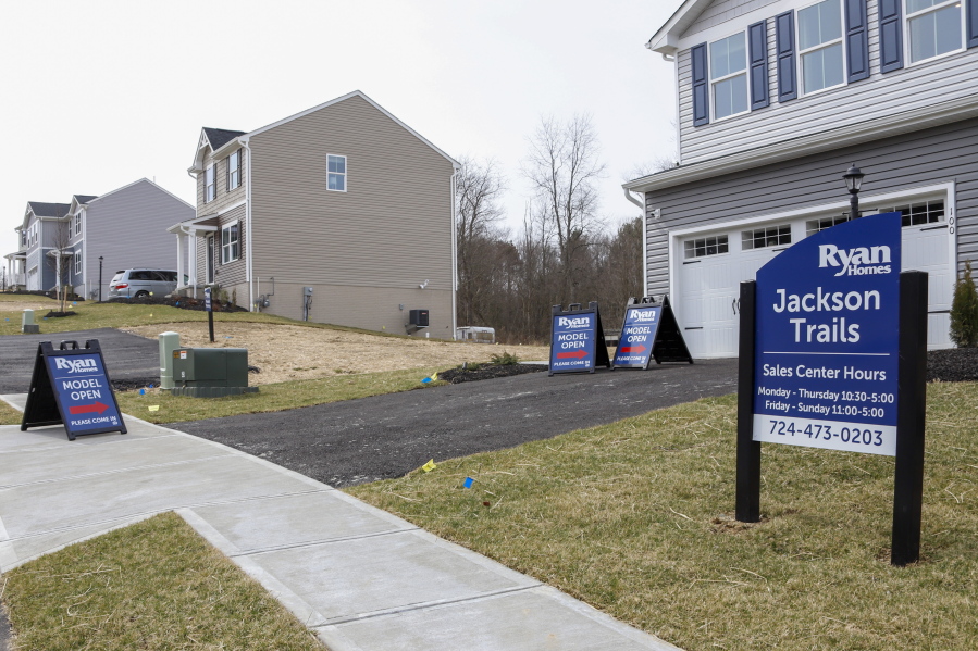 Model homes and for sale signs line the streets as construction continues at a housing plan in Zelienople, Pa., Wednesday, March 18, 2020. Sales of new homes fell by 3.5% in September to a seasonally-adjusted annual rate of 959,000 million units. The Commerce Department said Monday, Oct. 26, 2020, that despite the modest decrease, sales of new homes are up 32.1% from a year earlier, as the housing market remains strong despite the pandemic.