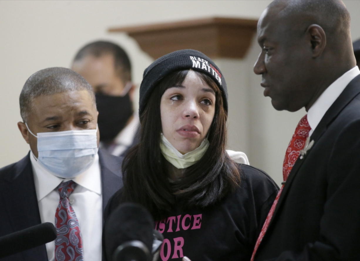Andre Hill&#039;s daughter, Karissa, attends a news conference held by family attorney Ben Crump, right, at the Beza Community Center on the east side of Columbus, Ohio, on Thursday, Dec. 31, 2020. Andre Hill, an unarmed Black man, was shot and killed by Columbus police officer Adam Coy early on Tuesday, Dec. 22. (Barbara J.
