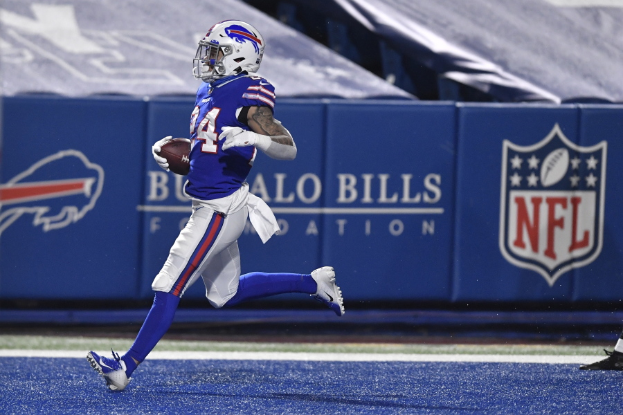 Buffalo Bills&#039; Taron Johnson (24) returns an interception for a touchdown during the second half of an NFL divisional round football game against the Baltimore Ravens Saturday, Jan. 16, 2021, in Orchard Park, N.Y.