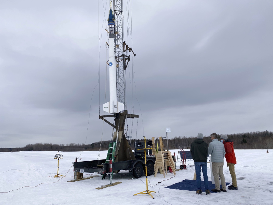 Members of bluShift Aerospace prepare for a test launch of a 20-foot rocket prototype, Thursday, Jan. 14, 2021, in Limestone, Maine. The company hopes to eventually use similar rockets to launch small satellites.
