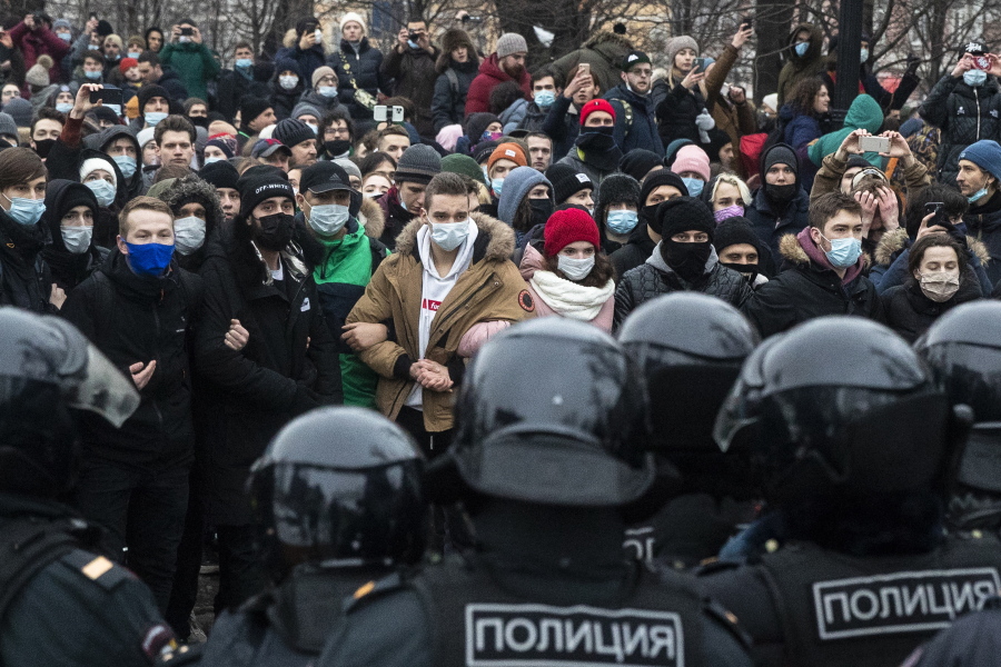 People stand in front of police officers during a protest against the jailing of opposition leader Alexei Navalny in Moscow, Russia, Saturday, Jan. 23, 2021. Russian police on Saturday arrested hundreds of protesters who took to the streets in temperatures as low as minus-50 C (minus-58 F) to demand the release of Alexei Navalny, the country&#039;s top opposition figure.