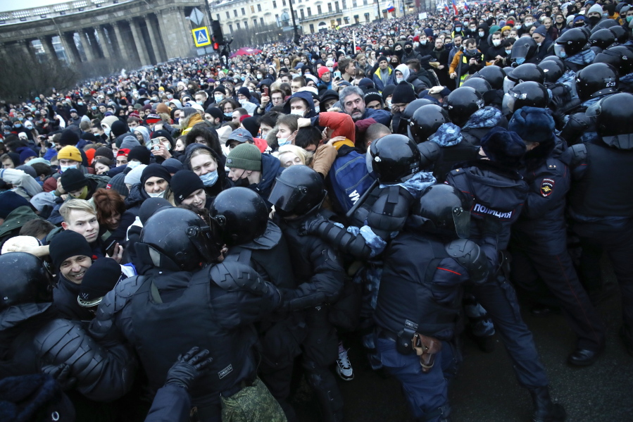 People clash with police during a protest against the jailing of opposition leader Alexei Navalny Saturday in St.