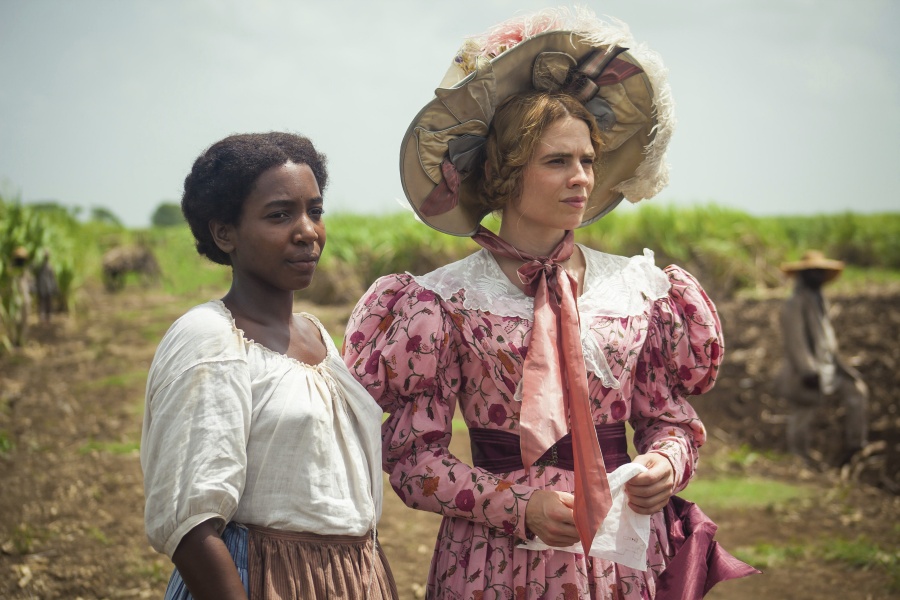 This image released by PBS shows Tamara Lawrance, left, and Hayley Atwell in a scene from the miniseries &quot;The Long Song&quot; debuting Jan.