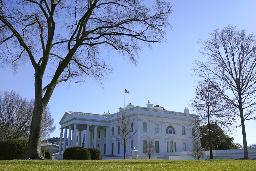 An American flag flies above the White House in Washington, Sunday, Jan. 10, 2021.