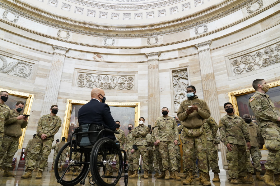 Rep. Brian Mast, R-Fla., gives troops a tour in the Rotunda on Capitol Hill in Washington, Wednesday, Jan. 13, 2021.