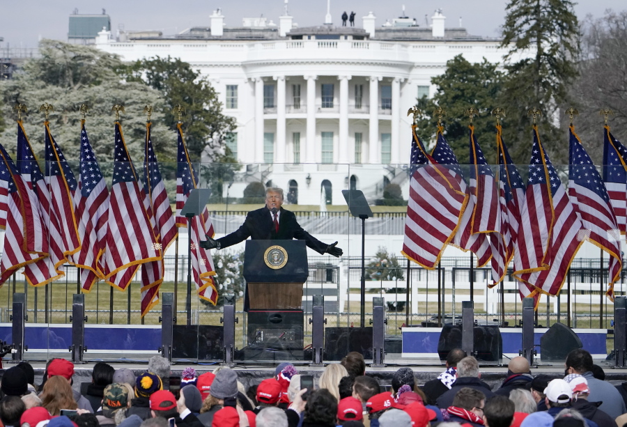 FILE - In this Jan. 6, 2021, file photo with the White House in the background, President Donald Trump speaks at a rally in Washington.