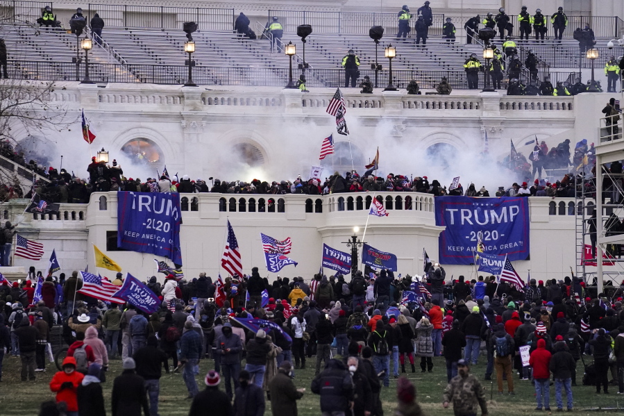 FILE - In this Jan. 6, 2021, file photo violent rioters, loyal to President Donald Trump, storm the Capitol in Washington. The words of Donald Trump supporters who are accused of participating in the deadly U.S. Capitol riot may end up being used against him in his Senate impeachment trial as he faces the charge of inciting a violent insurrection.