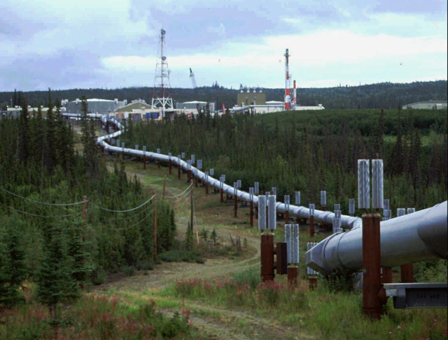 FILE - In this undated file photo the Trans-Alaska pipeline and pump station north of Fairbanks, Alaska is shown. The International Energy Agency says oil and gas companies aren&#039;t doing enough to reduce the release of methane, a potent source of planet-heating emissions, that is seeping out of pipelines and production plants.