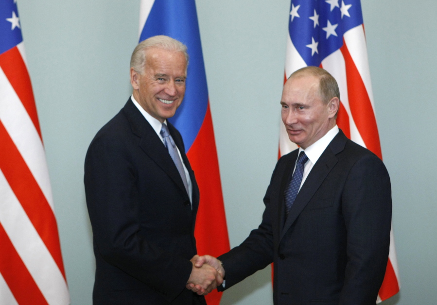 FILE - In this March 10, 2011, file photo, then-Vice President Joe Biden, left, shakes hands with Russian Prime Minister Vladimir Putin in Moscow, Russia.  President Joe Biden has been thrown into a high-wire act with Russia as he seeks to toughen his administration&#039;s stance against Putin while preserving room for diplomacy in a post-Donald Trump era.