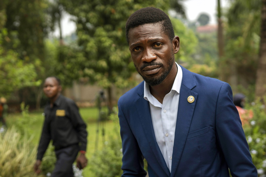 Uganda&#039;s leading opposition challenger Bobi Wine walks back to his residence after giving a press conference outside Kampala, Uganda, Friday,Jan. 15, 2021, one day after Ugandans went to the polls. Uganda&#039;s electoral commission says President Yoweri Museveni leads in Thursday&#039;s election with results in from 29% of polling stations. He has 63% of ballots while top opposition candidate Bobi Wine has 28%. Wine, a popular singer-turned-lawmaker half the president&#039;s age, alleges that the vote in the East African country was rigged.